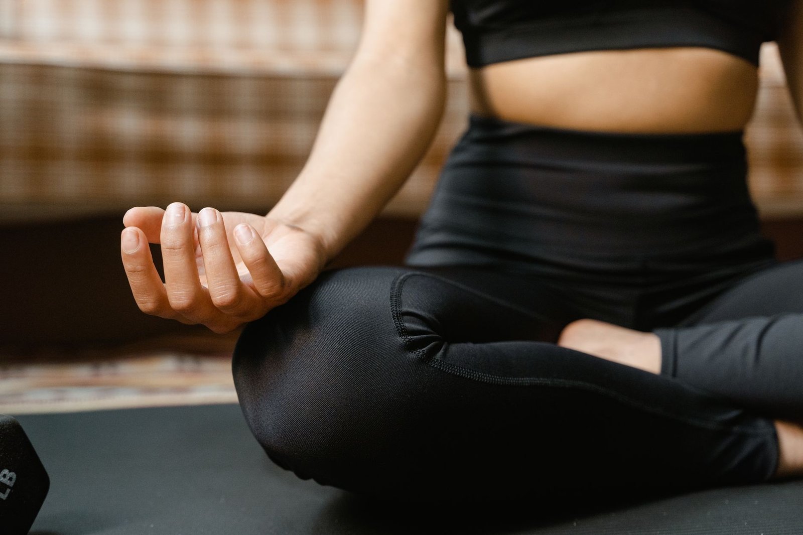 Person sitting calmly with eyes closed, practicing mindfulness