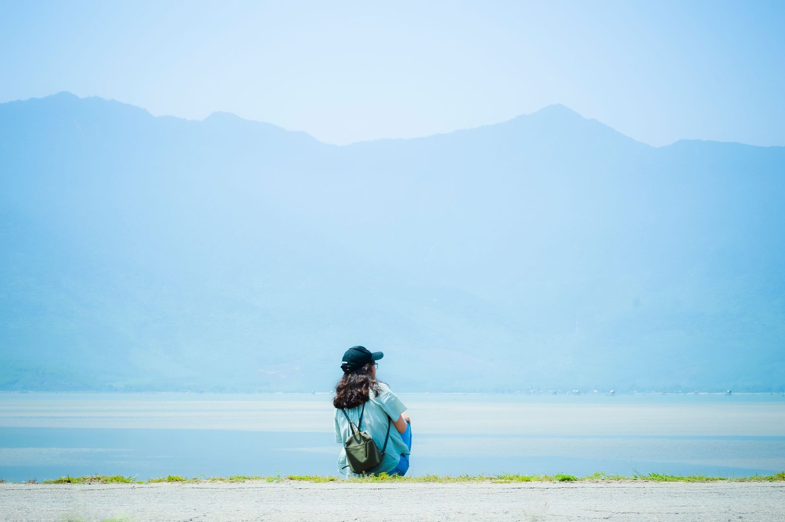 Person relaxing peacefully outdoors, embodying balance and calm