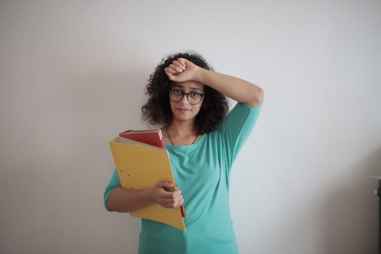 Tired woman resting her head on her hand, overwhelmed by too many choices