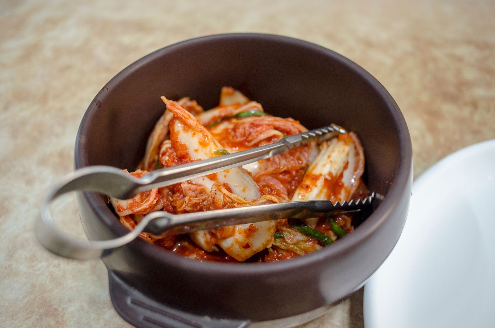 Assortment of fermented foods like yogurt, kimchi, and kefir