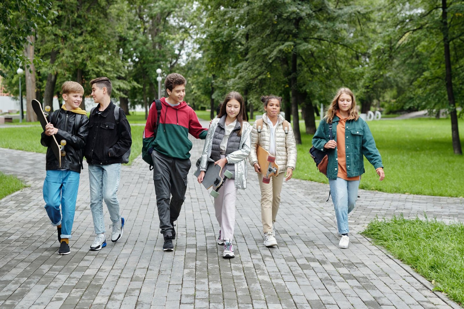 Two friends walking and talking outdoors, representing connection and community