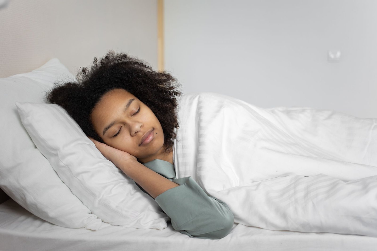 Person sleeping deeply and peacefully in a calm bedroom