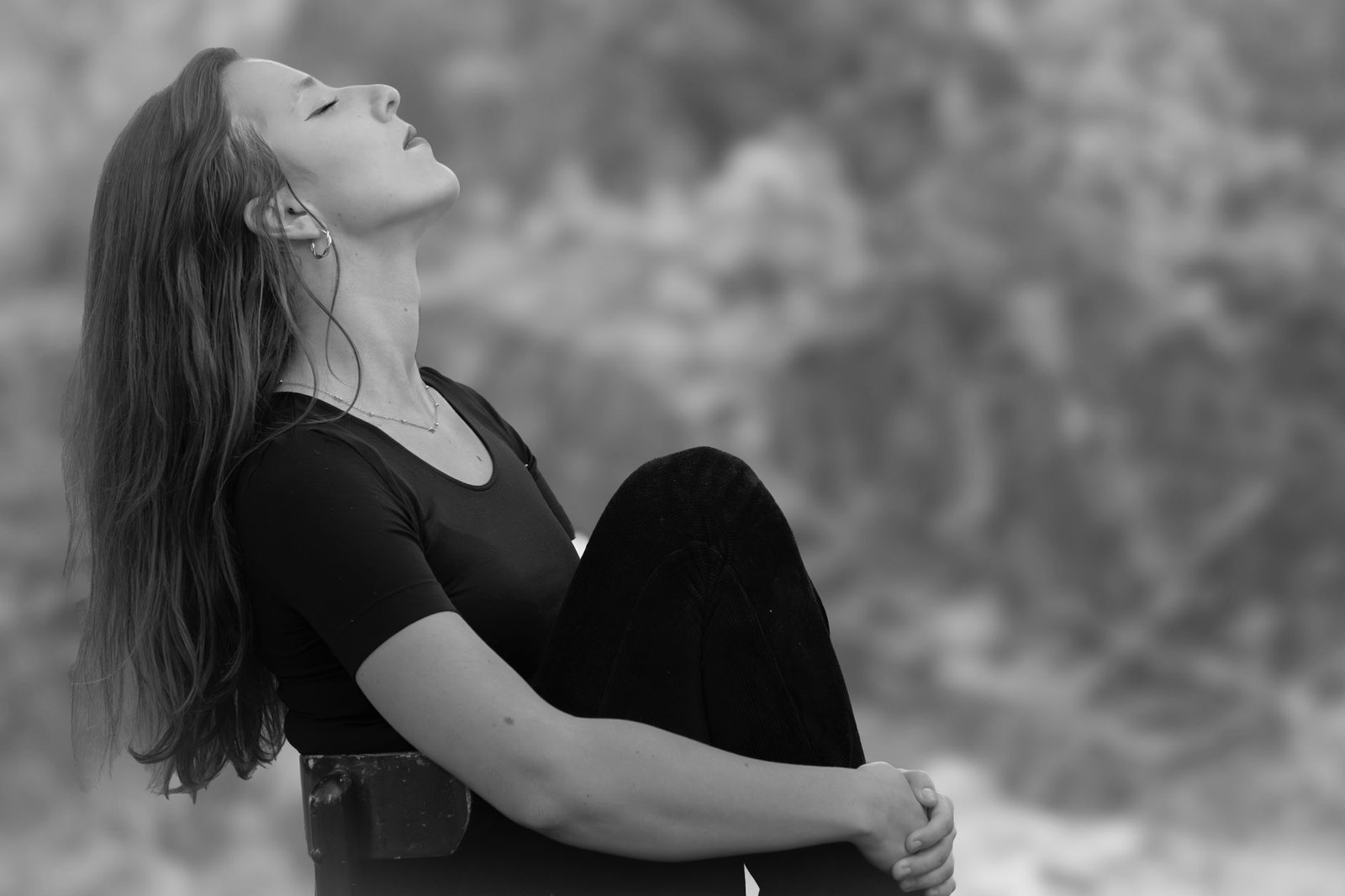 Woman pausing to take a deep breath before reacting to her emotions