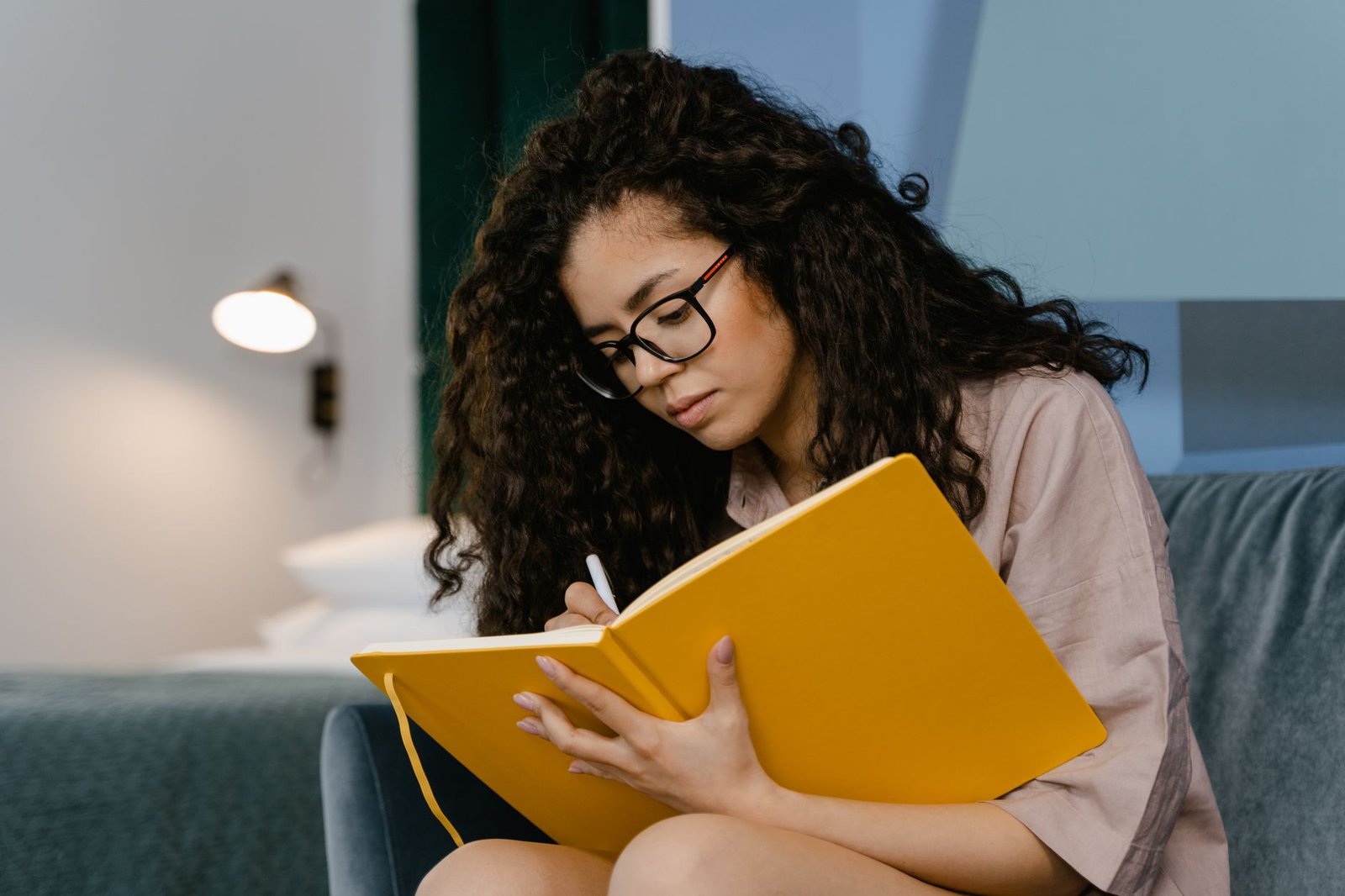 Woman journaling as an act of self-compassion and reflection
